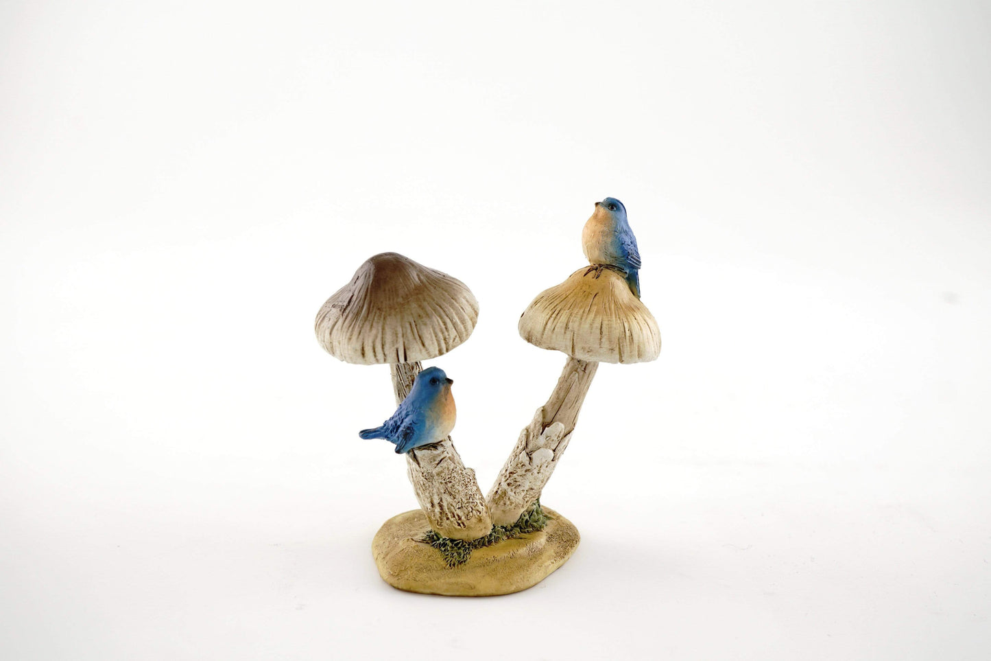 Bluebirds On Mushroom.