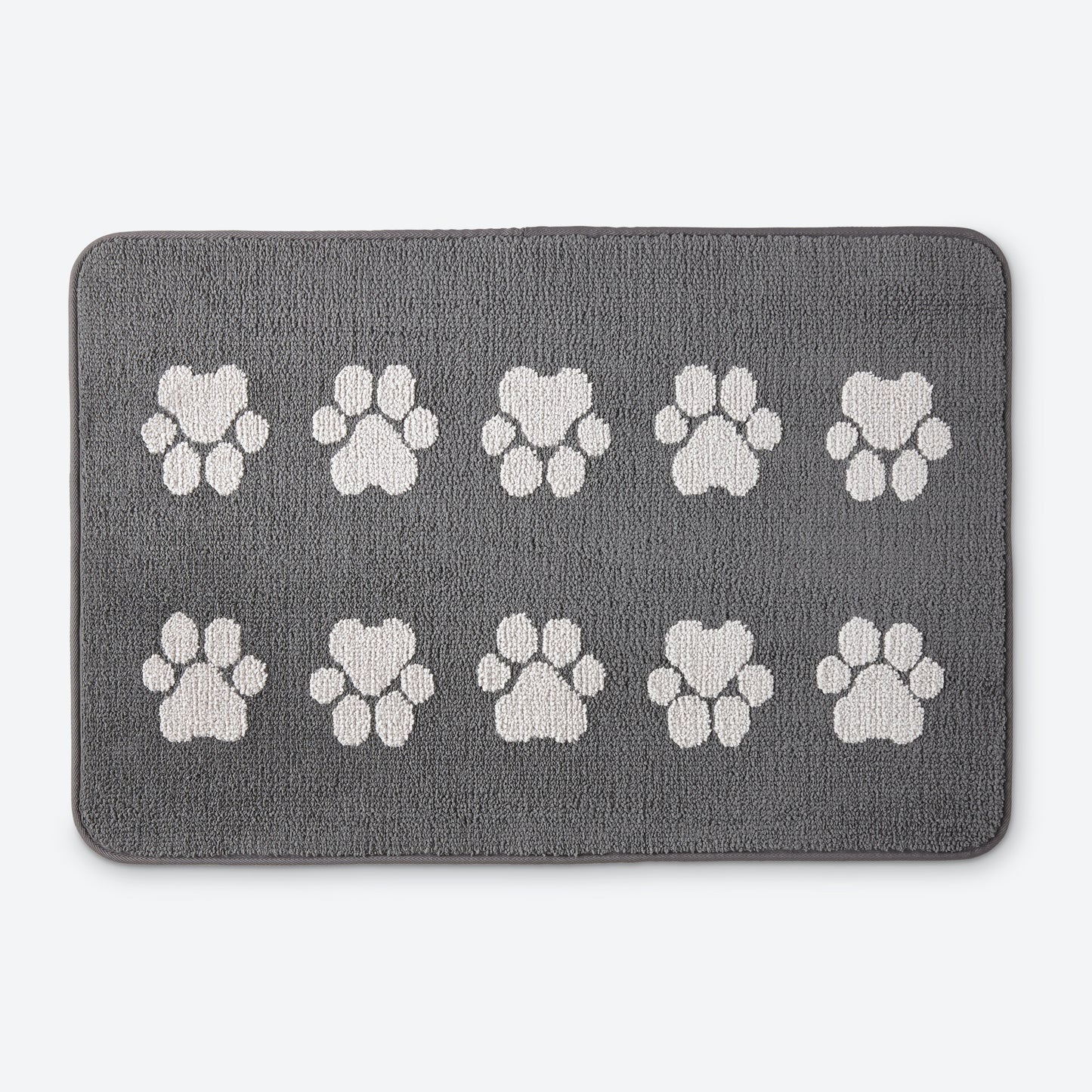 Norwex Pet Door Mat - graphite with white paw prints, top view with fluffy dog
