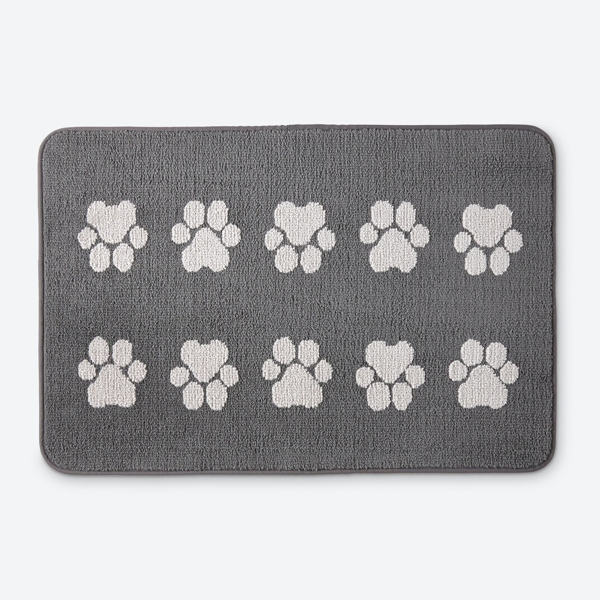Norwex Pet Door Mat - graphite with white paw prints, top view with fluffy dog