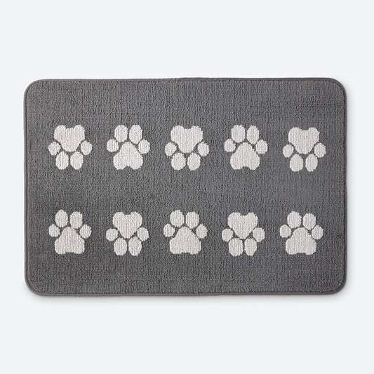 Norwex Pet Door Mat - graphite with white paw prints, top view with fluffy dog