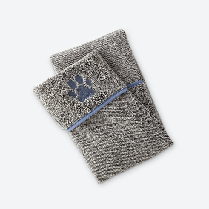 Norwex Pet Towel in use - happy golden retriever wrapped in gray pet towel