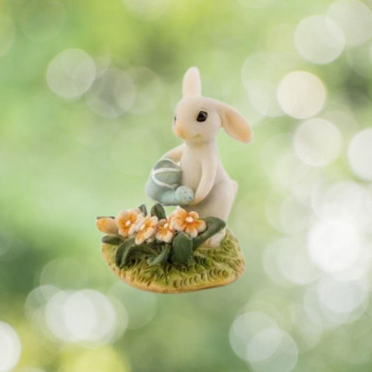 Bunny Gardener Watering the Flower Bed.